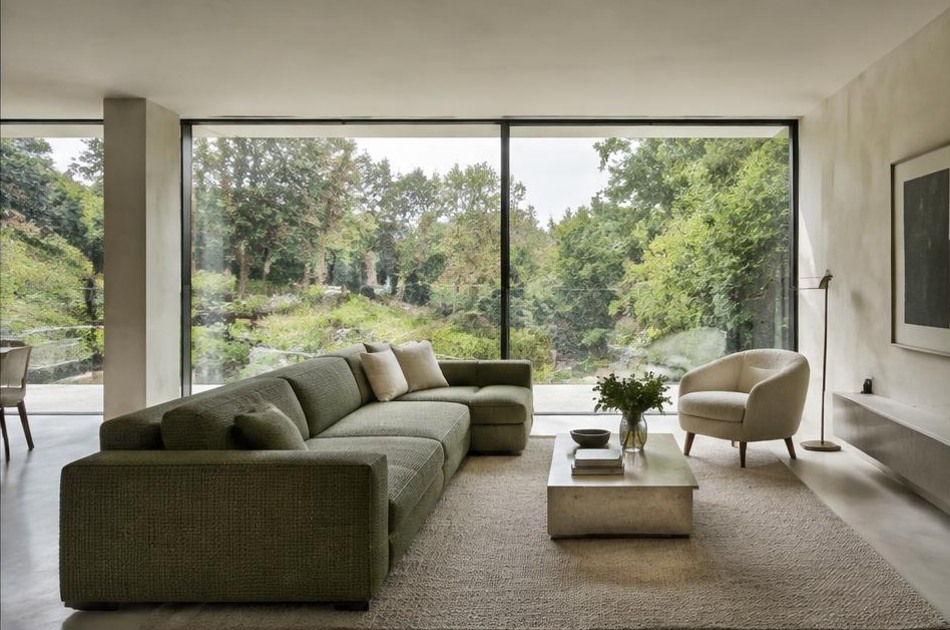Minimalist contemporary living space with local residential garden views in Highgate