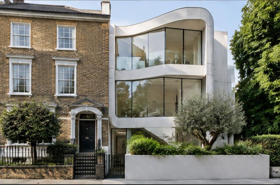 Retained historic facade beside a dominant contemporary glazed addition in Highgate