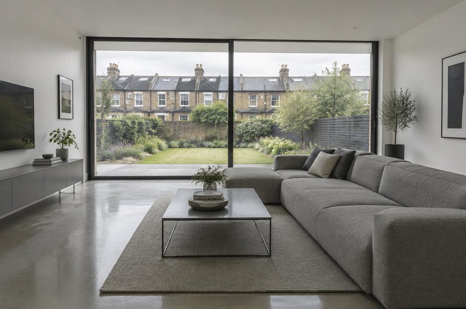 Contemporary living space opening onto a garden in Hounslow