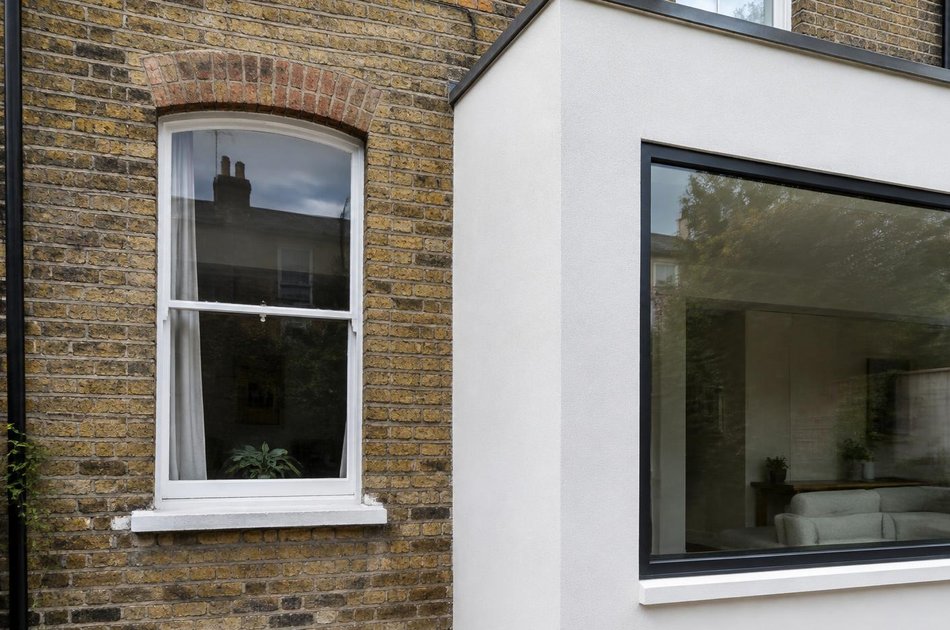 Period facade beside a new contemporary extension in Hounslow Town