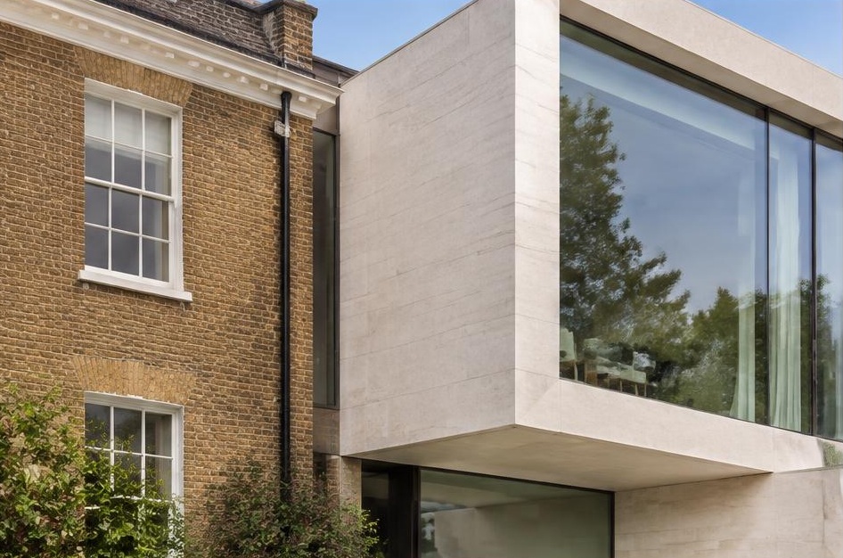 Retained period facade beside a prominent contemporary glazed addition in Hurlingham