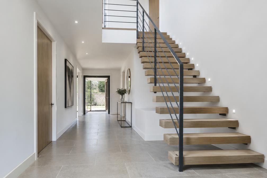 Refurbished modern hall with a floating oak staircase in Ickenham