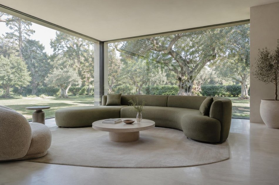Contemporary living space opening onto a garden in Isleworth