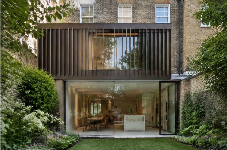 Contemporary glazed garden extension behind a period home in Kennington