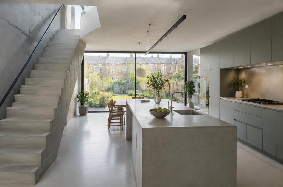 Completed contemporary kitchen and open staircase with garden glazing in Kentish Town