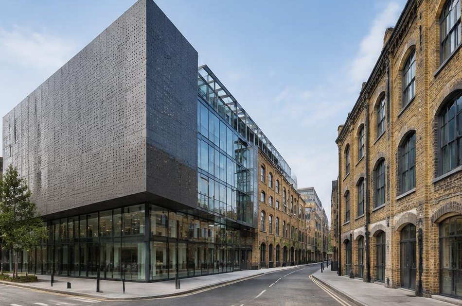 Contemporary perforated steel residence beside period buildings in King's Cross