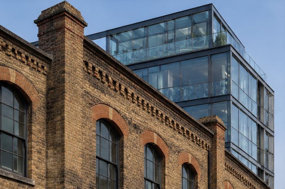 Retained historic facade beside a bold contemporary addition in King's Cross
