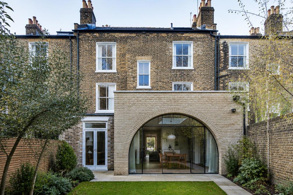 Victorian terrace with an arched pale-brick rear extension in Leyton
