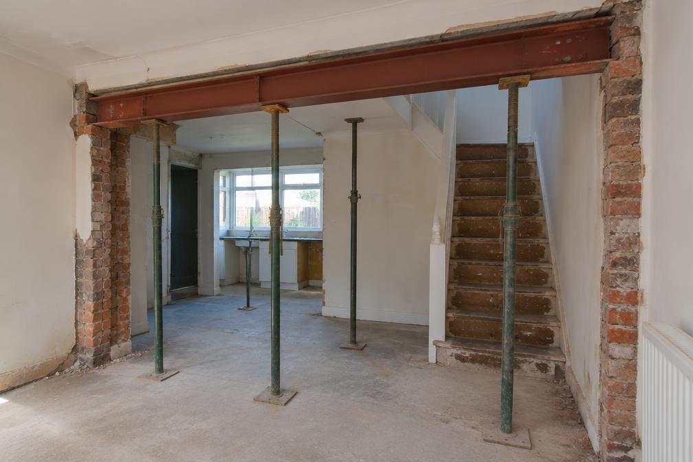 Steel beam and props during internal wall removal in Leytonstone