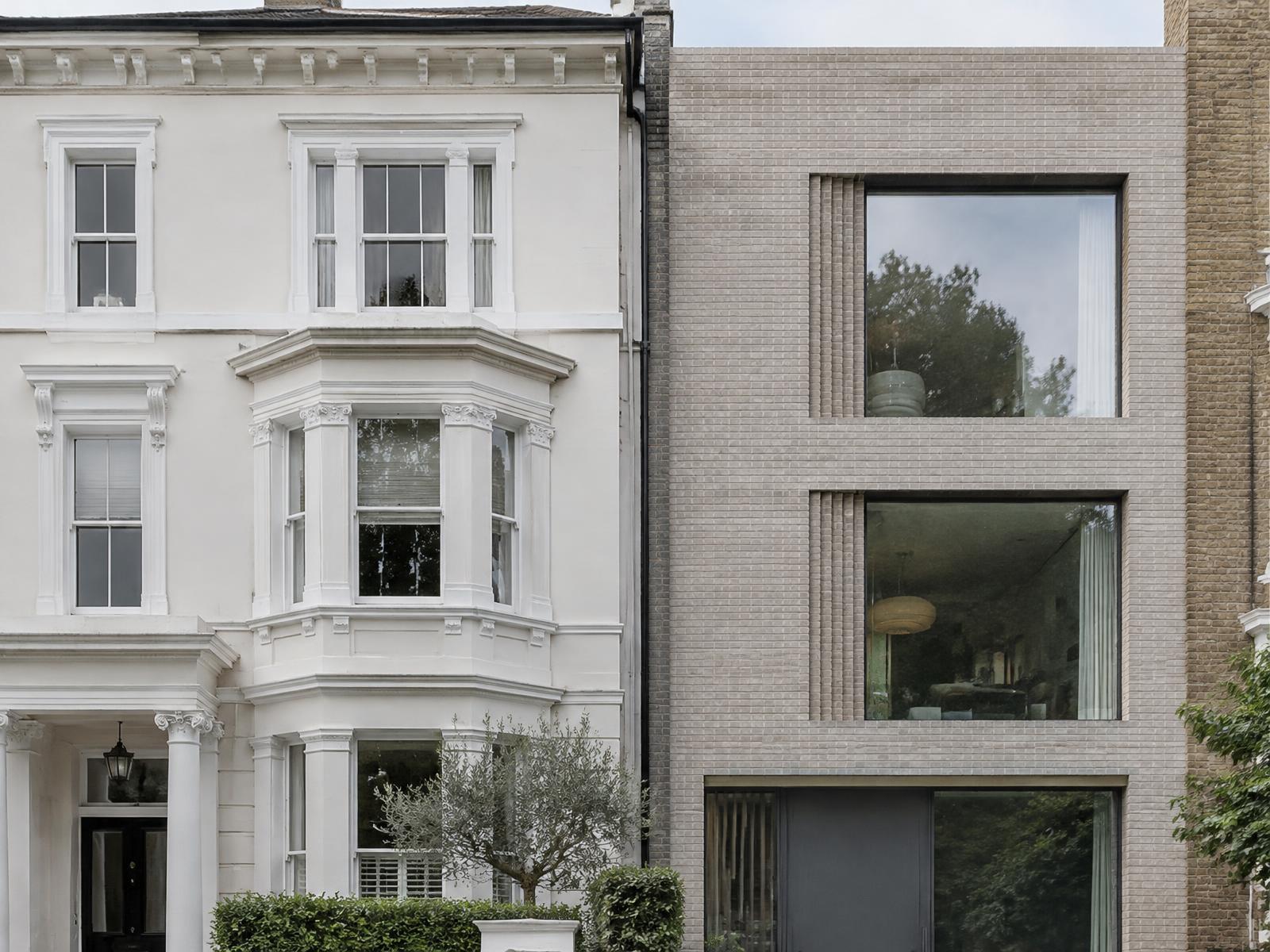 White stucco Victorian villa directly beside a contemporary pale brick infill house in Maida Vale