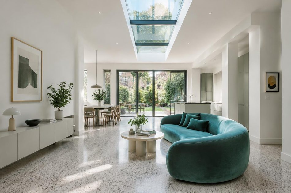 Refurbished Victorian terrace interior with a curved teal sofa in Mitcham
