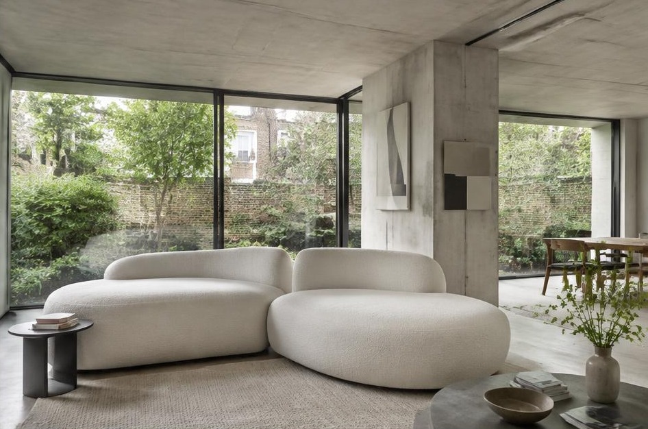 Minimalist garden living space with broad glazing in Mortlake