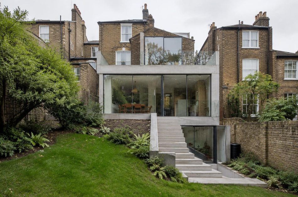 Split-level concrete and glass extension on a sloping garden in New Cross