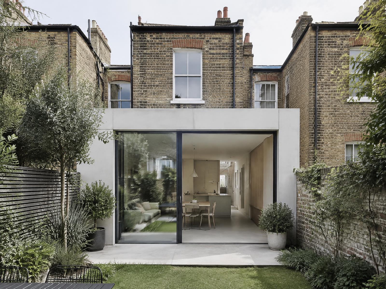 Victorian terraced cottage with a pale concrete and glass rear extension