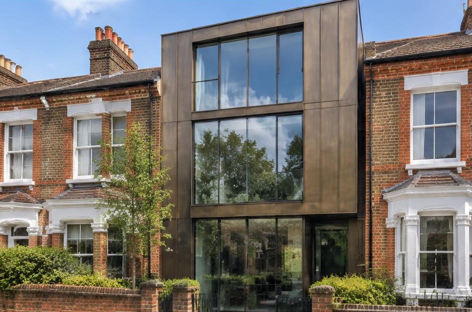 Retained period facade beside a prominent contemporary glazed addition in Northcote Road