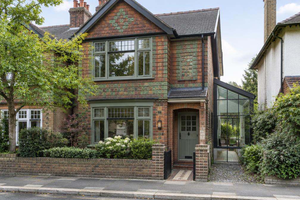 Period house front with a glazed side extension in Northwood