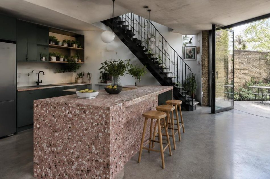 Contemporary kitchen with an open staircase and glazing onto a residential garden in Peckham