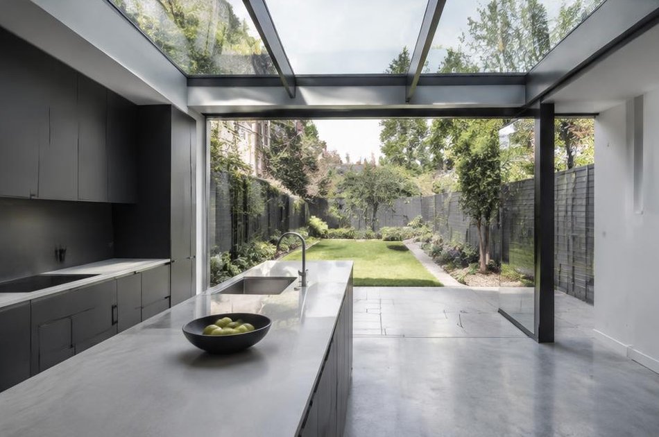Glass-roofed kitchen extension onto a garden in Plumstead