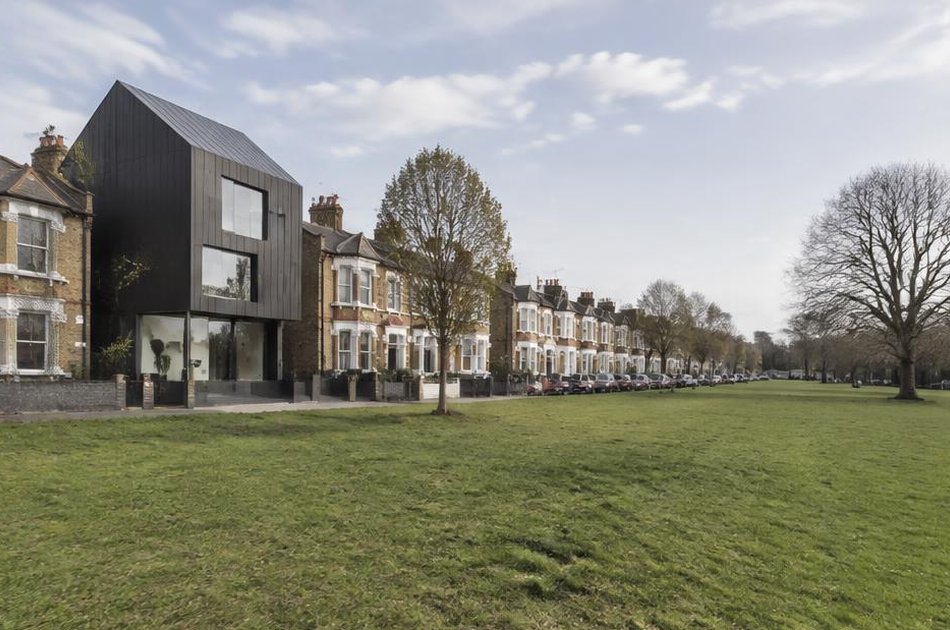 Victorian terraces facing Plumstead Common with a contemporary dark-clad house