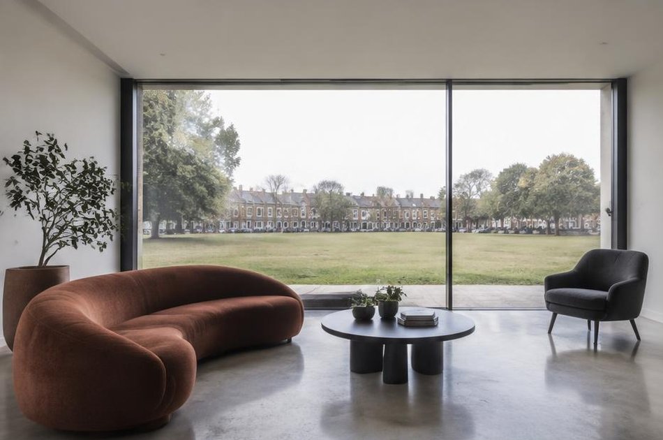 Living room with broad glazing over Plumstead Common