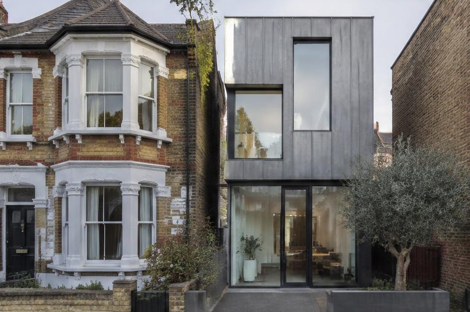 Victorian bay-fronted house beside a contemporary zinc infill house in Plumstead