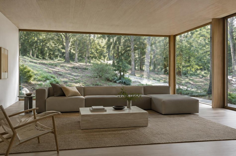 Contemporary living space opening onto a garden in Purley
