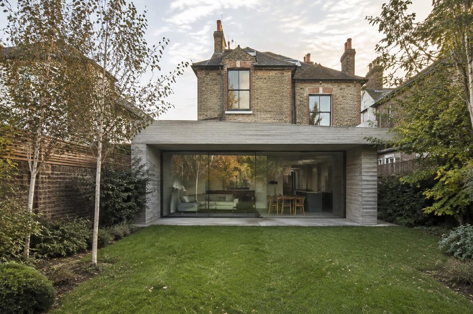 Board-marked concrete rear extension to a Victorian villa in Raynes Park
