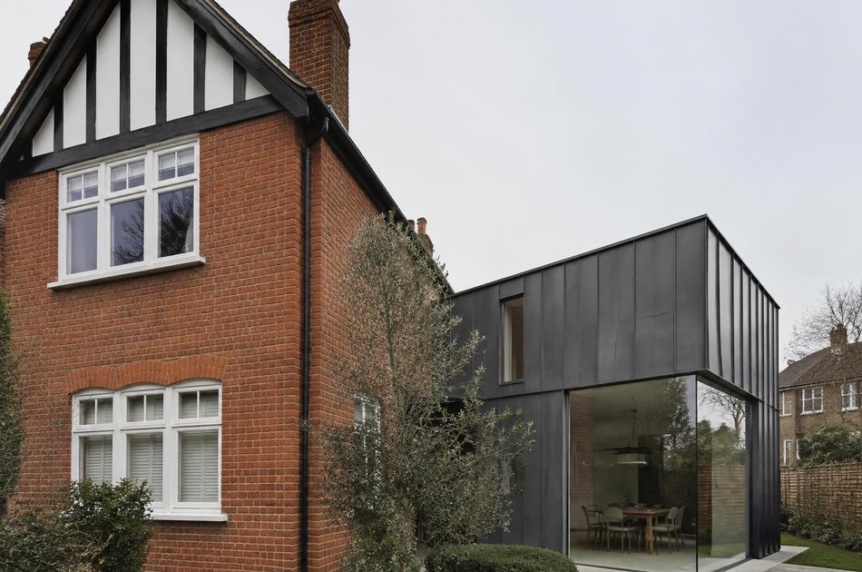 Edwardian gabled house beside a zinc-clad glazed extension in Raynes Park