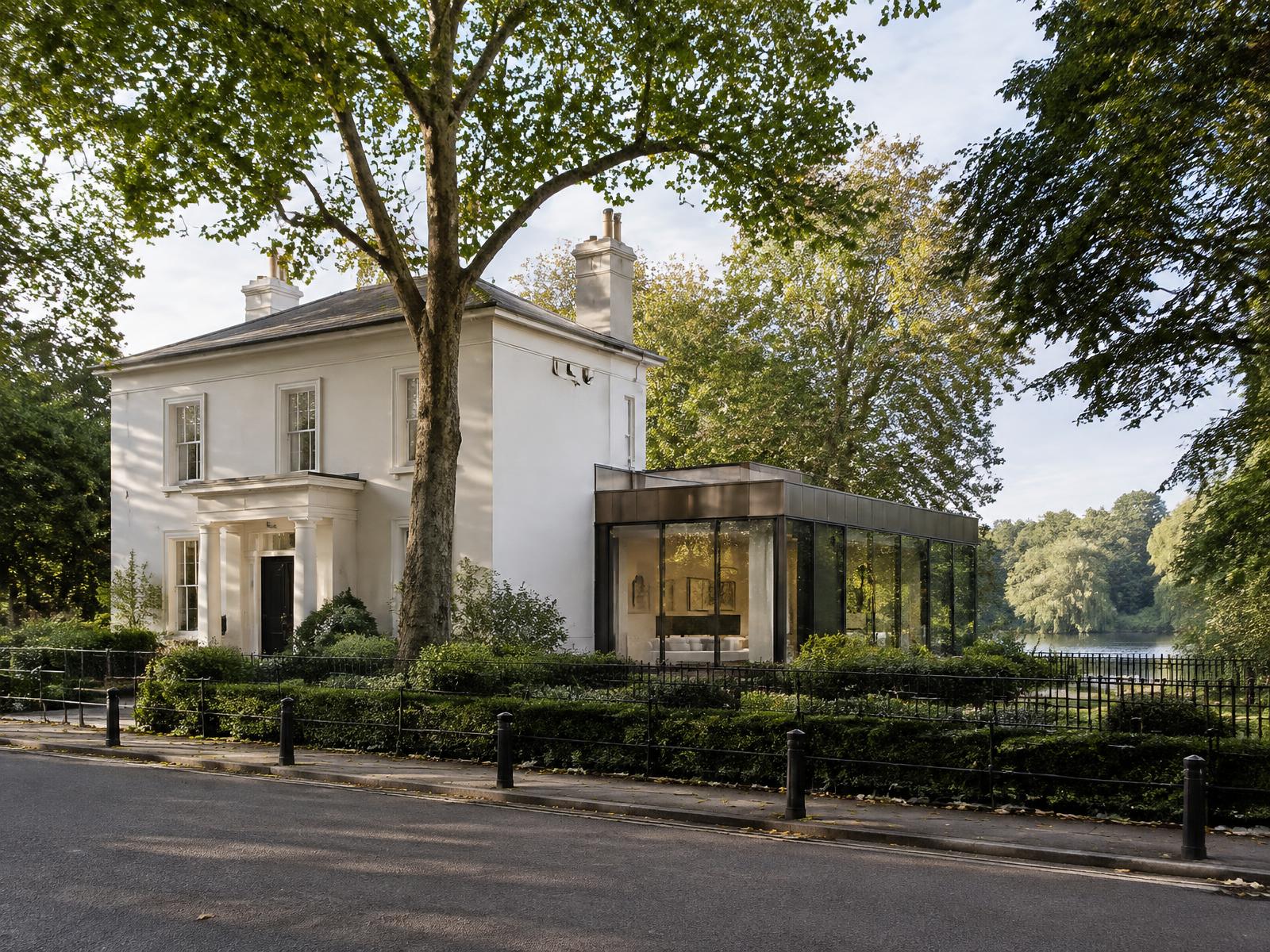 Regent's Park stucco villa with a contemporary bronze and glass garden wing beside the lake
