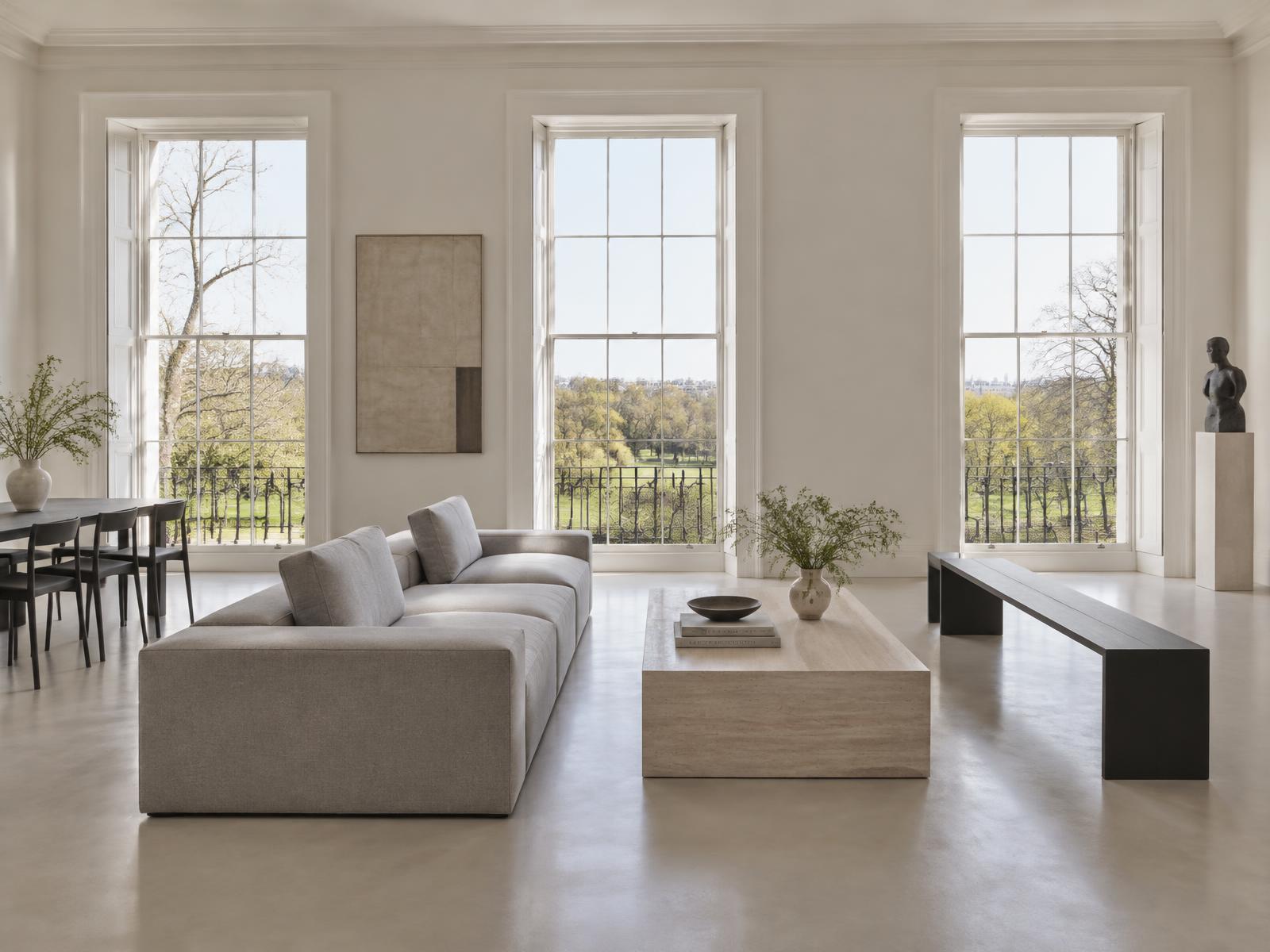 Minimalist grand room in a Nash terrace with a square-edged grey sofa and tall windows over Regent's Park