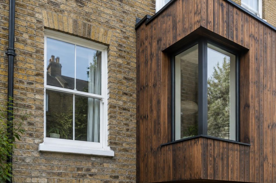 Period facade beside a new contemporary extension in Romford
