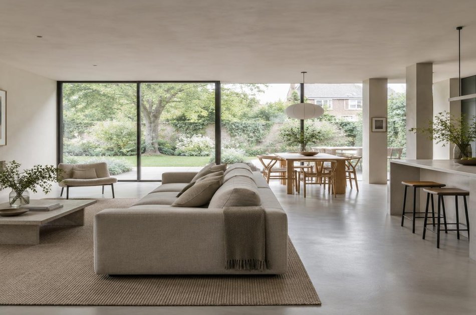 Contemporary living space opening onto a garden in Southgate