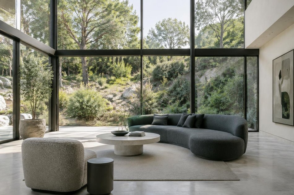 Contemporary living space opening onto a garden in Stanmore