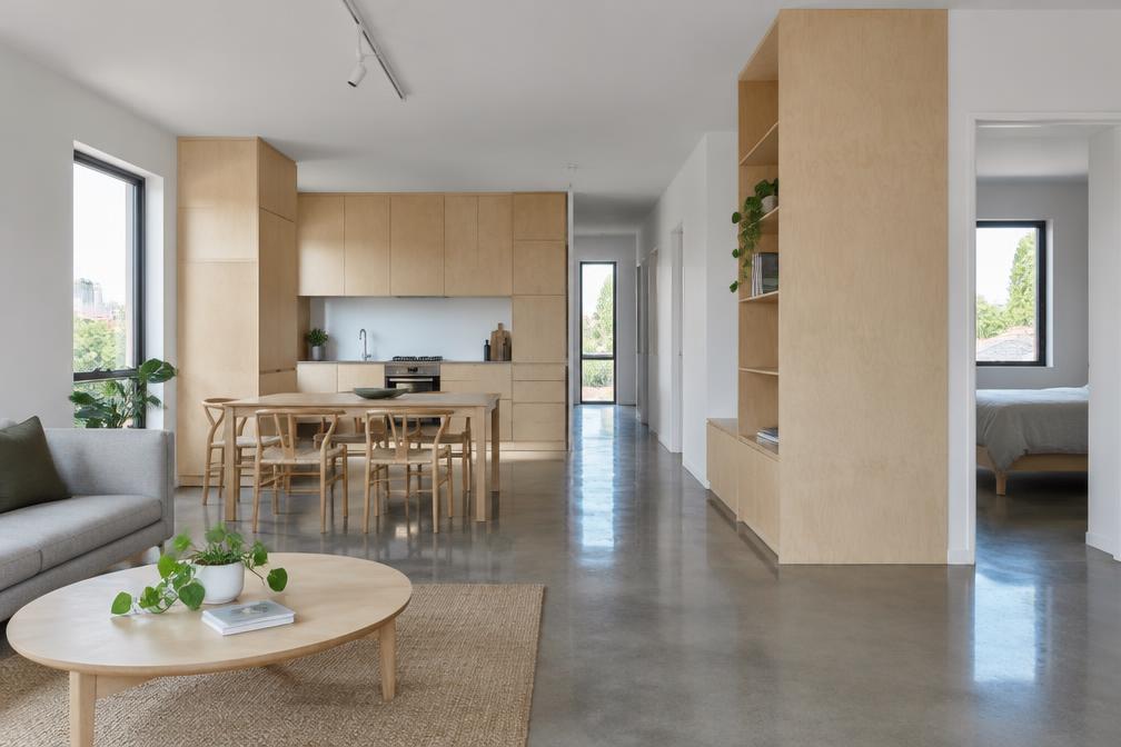 Refurbished flat with polished concrete floor, birch plywood joinery and white walls