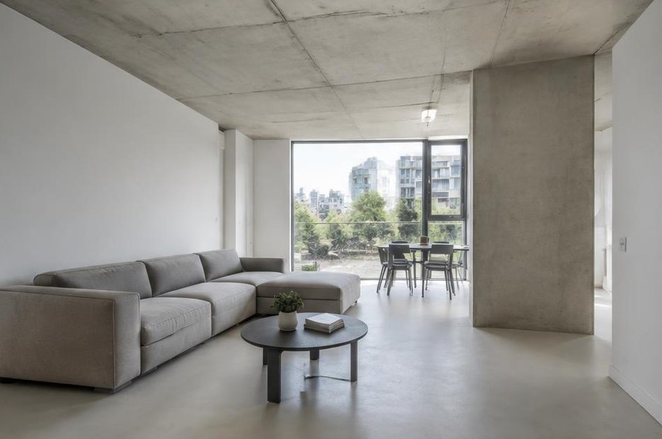 Refurbished interior with exposed concrete ceiling in Thamesmead