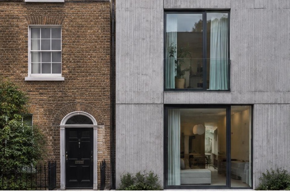 Retained historic facade directly beside a contemporary glazed residential addition in Vauxhall