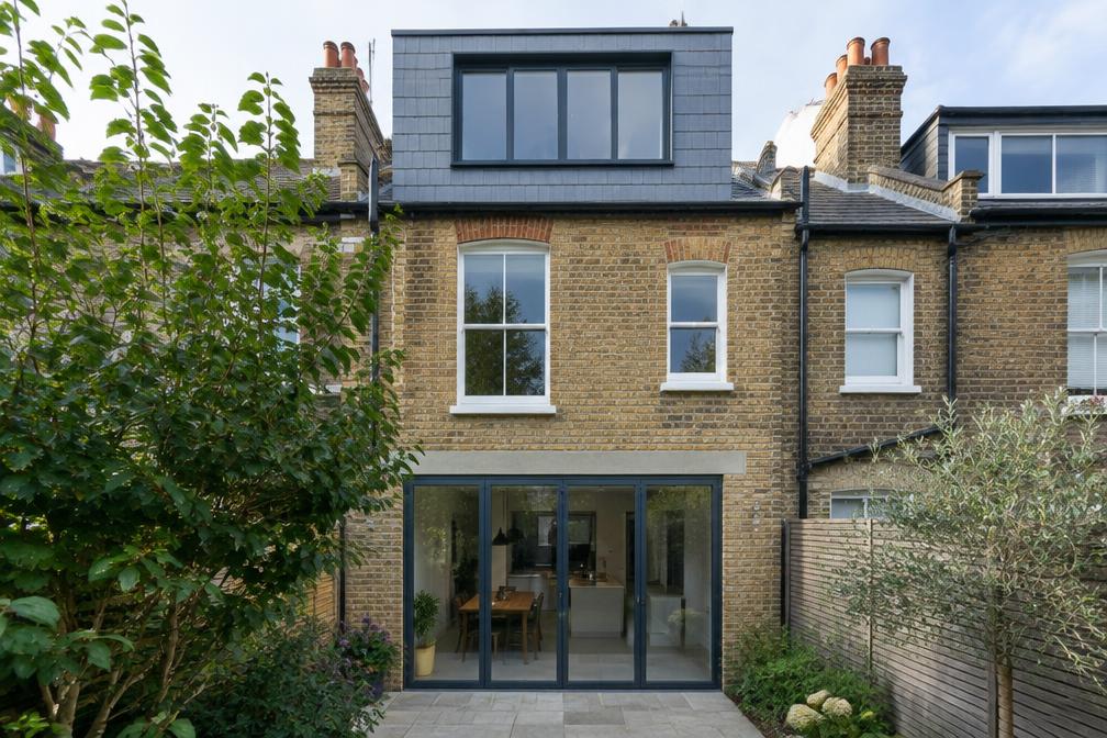 Edwardian terrace rear with a slate-clad loft dormer in Waltham Forest
