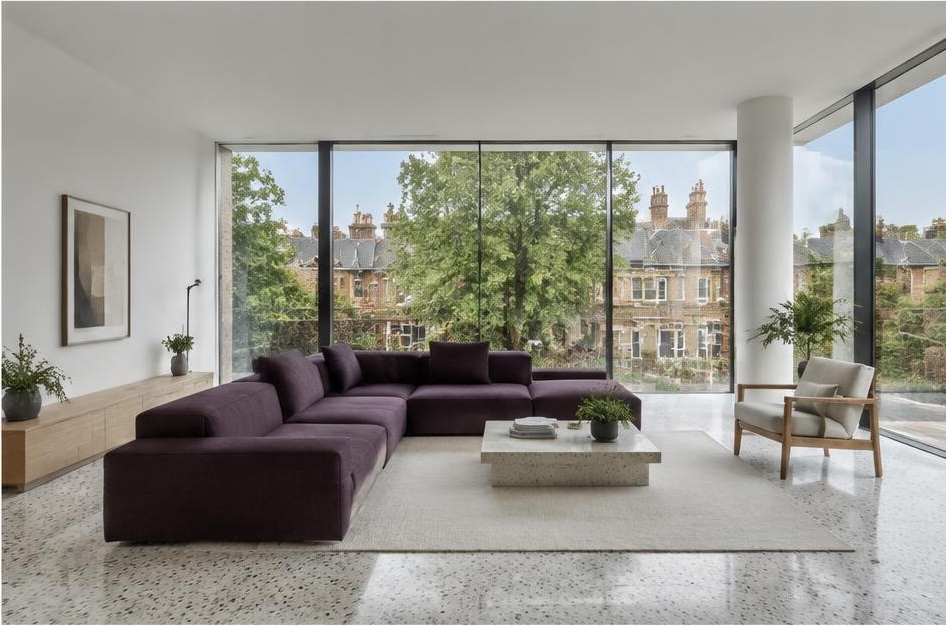 Minimalist living room with a structured fabric sofa and views of Wandsworth Common homes and gardens