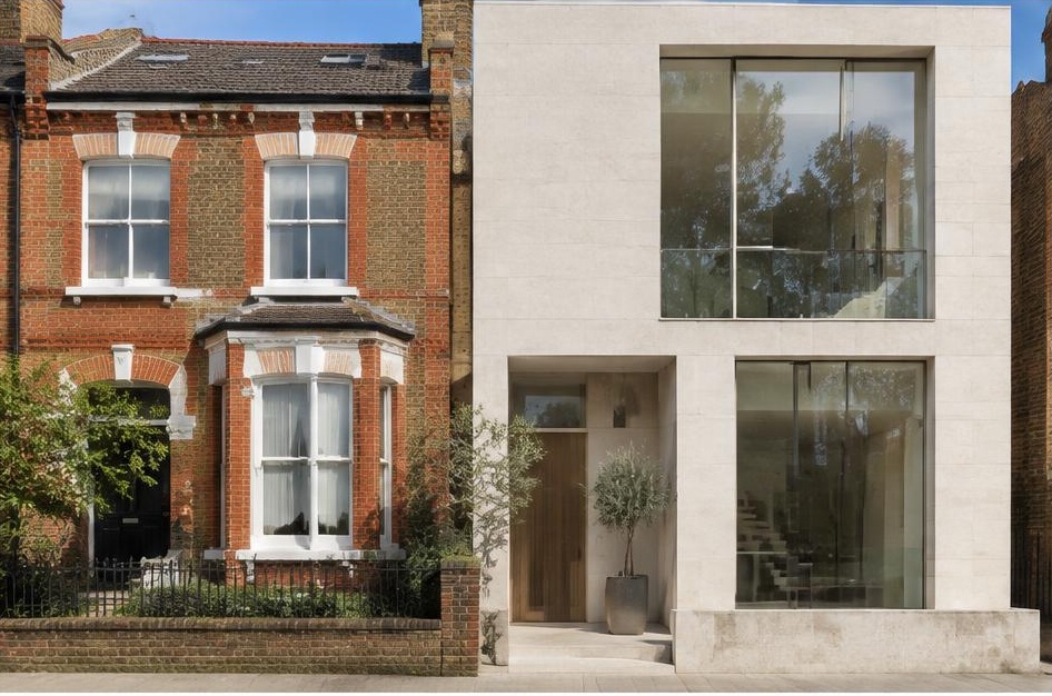 Retained period facade beside a prominent contemporary glazed addition in Balham