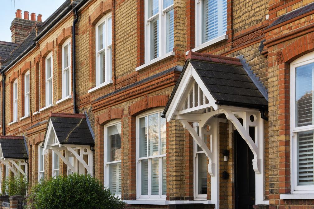 Terrace of Victorian and Edwardian houses with bay windows on a quiet street