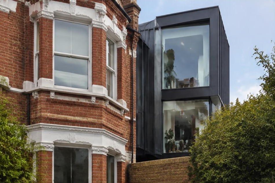 Retained original facade beside a dominant contemporary addition in West Hampstead
