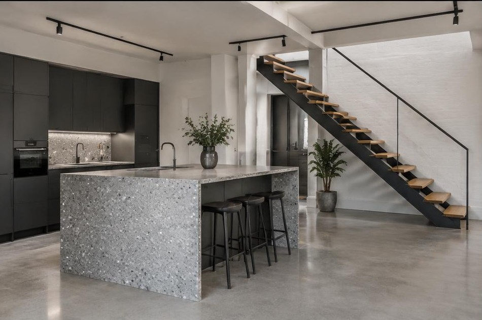 Completed contemporary kitchen with open staircase and garden glazing in Whitechapel