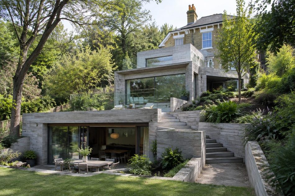 Stepped concrete and glass garden extension to a Victorian villa in Wimbledon