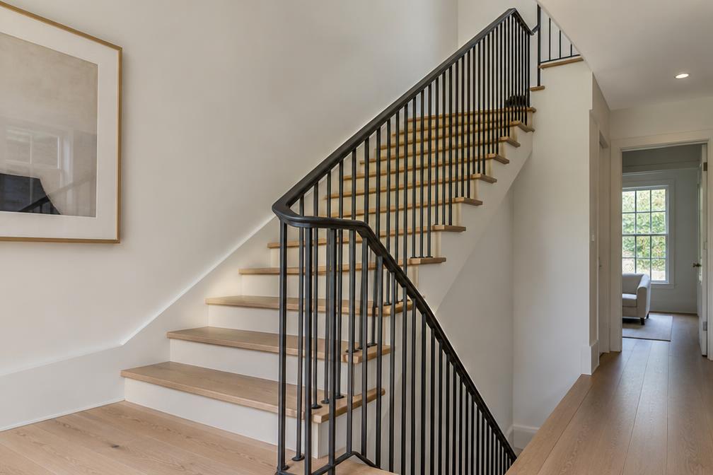 Refurbished staircase with oak treads and steel balustrade in Wood Street